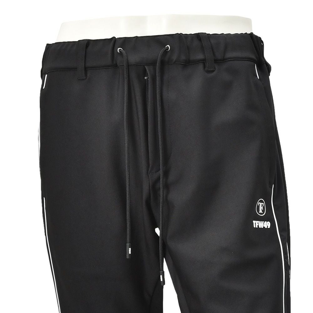TFW49ティーエフダブリューフォーティーナイントラックパンツメンズジャージーパンツブラック黒配色パターン異素材切り替え2WAYキックバックUVカット吸水速乾多機能国内正規品でらでら公式ブランド