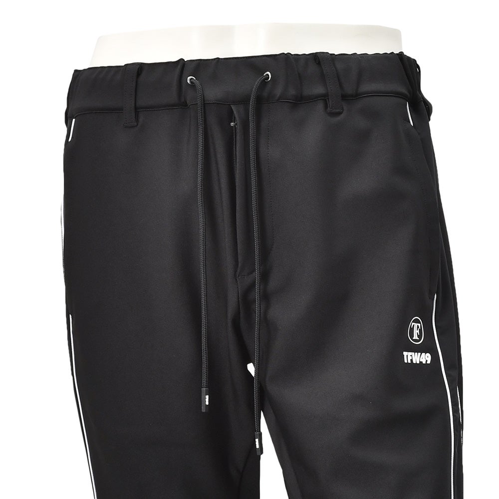 TFW49ティーエフダブリューフォーティーナイントラックパンツメンズジャージーパンツブラック黒配色パターン異素材切り替え2WAYキックバックUVカット吸水速乾多機能国内正規品でらでら公式ブランド